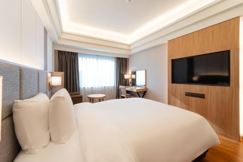 TV a/nebo společenská místnost v ubytování Hotel Interburgo Daegu