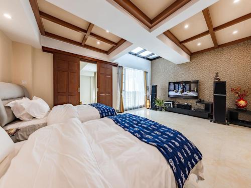 En eller flere senge i et værelse på Annie Dianchi Lake Villas