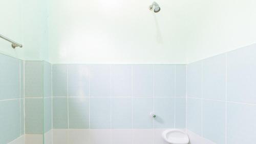 a bathroom with a shower and a toilet at En Gedi Beach Resort by RedDoorz in Iba