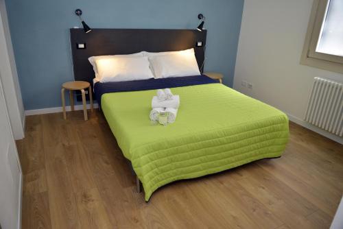 מיטה או מיטות בחדר ב-La Casa Ritrovata