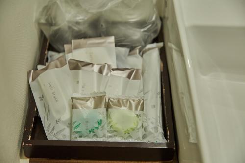a container filled with paper in a refrigerator at Riverside Arashiyama in Kyoto