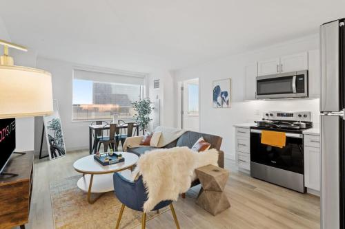a kitchen and living room with a couch and a table at Spacious 2BR CozySuites Condo at Showboat #24 in Atlantic City