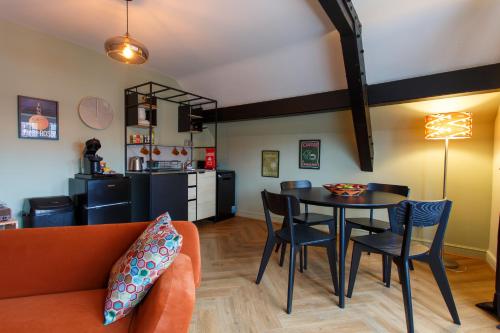a living room with a couch and a table at Comfy and Bright 1 Bedroom Self-Catering Flat in Chester