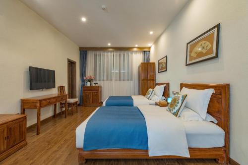 Katil atau katil-katil dalam bilik di Floral Qinyuan Light Luxury Inn Lijiang Ancient Town Flagship Store-花筑沁园轻奢客栈丽江古城店