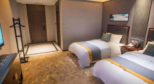 Postel nebo postele na pokoji v ubytování Shell Hotel Tai'an Feicheng Longshan Road