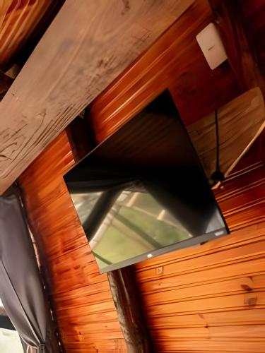 a ventilator hanging from the ceiling of a room at Espaço Gaia in Santana do Riacho