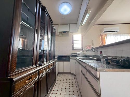 a kitchen with a sink and a counter top at 雲海坊 in Kannami