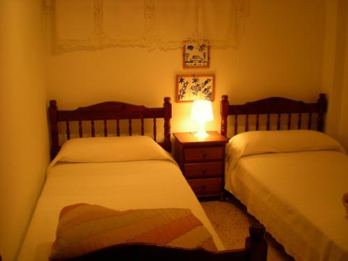 Giường trong phòng chung tại Valparaiso Seafront