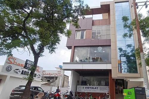 a building with motorcycles parked in front of it at Hotel O Shagun hotel and Banquets in Gomti Nagar
