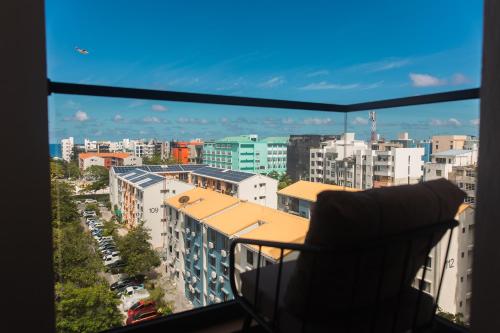 a view of a city from a balcony at Comfy Quite Private Room with Private Balcony - Hulhumale in Hulhumale
