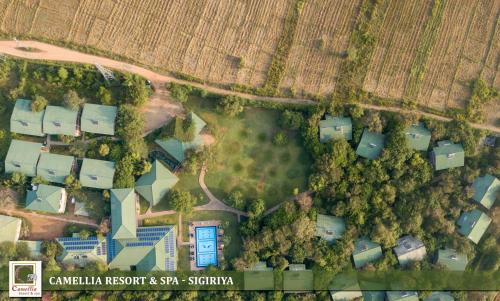 an overhead view of a yard with houses and trees at Camellia Resort And Spa Sigiriya - Sri Lanka in Avudangawa