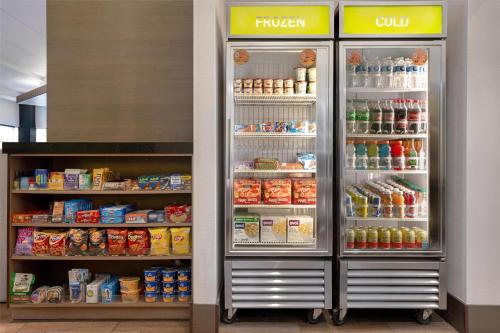 a refrigerator with its doors open in a store at Home2 Suites by Hilton Philadelphia Convention Center in Philadelphia