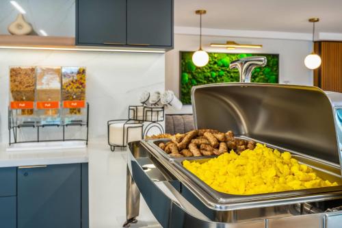 a kitchen with a counter with a tray of food at Comfort Inn in Guelph