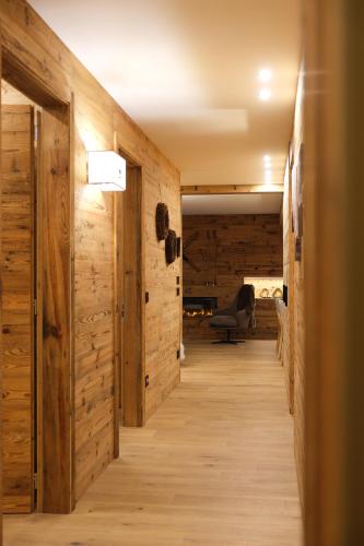 a hallway of a house with wooden walls at Leos Chalet in Valdaora di Sopra
