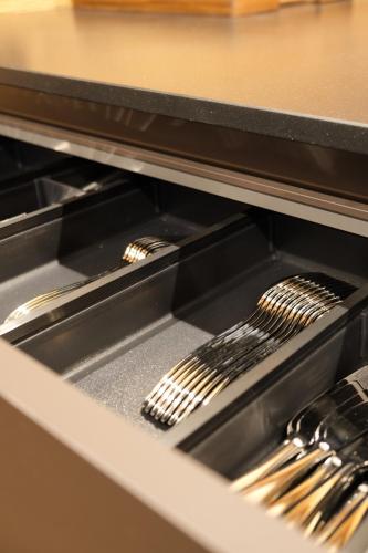 two utensils are sitting inside of an oven at Leos Chalet in Valdaora di Sopra