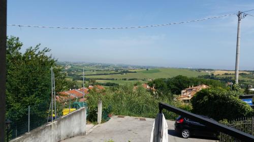 a car parked in a parking lot on a hill at Il borgo in Tavullia