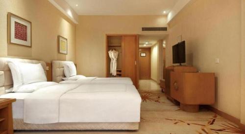 Letto o letti in una camera di Hongzhushan Hotel Mount Emei