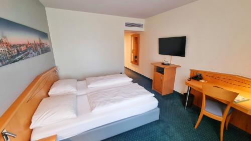 Ένα ή περισσότερα κρεβάτια σε δωμάτιο στο Hotel Panorama Hamburg-Harburg