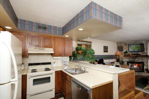 a kitchen with a sink and a stove at Bear Creek 167 in Gatlinburg