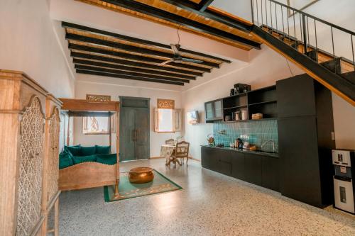 a kitchen and living room with a loft at La Marrocco Villas in Nusa Penida
