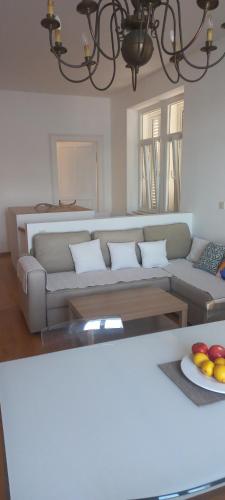 a living room with a couch and a table at Bellvedere in Tivat