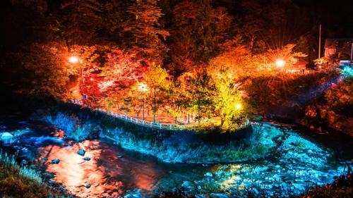an overhead view of a river at night at Kanesada Ryokan in Kuroishi