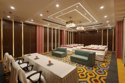 a conference room with rows of tables and chairs at Zone Connect by The Park Patna 