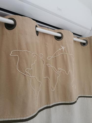 a curtain with a drawing of a mountain on it at Il Vialetto in Elmas