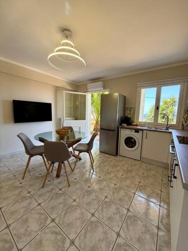 a kitchen with a table and chairs in a room at Casa Limone in Argostoli