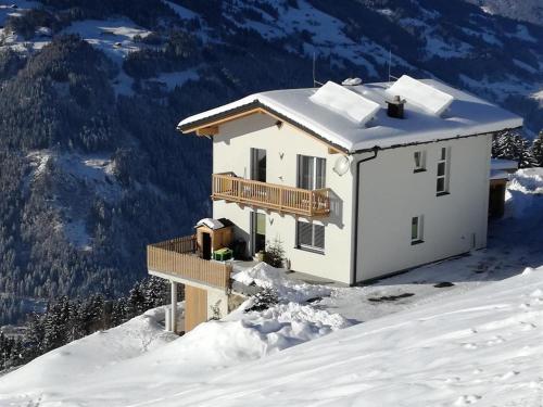 a house on top of a snow covered mountain at Haus Angela in Rohrberg