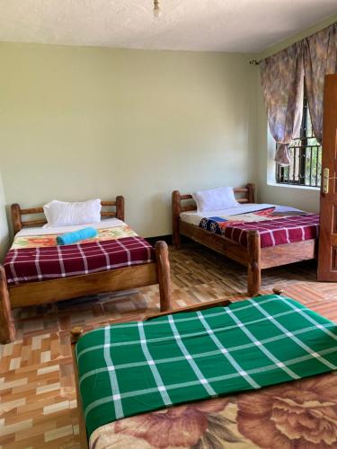 Una cama o camas en una habitación de Florence homestay sipi falls