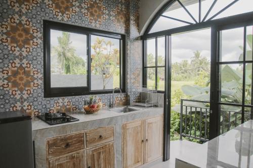 Kuchyň nebo kuchyňský kout v ubytování Sunset Villas Bungalow Ubud