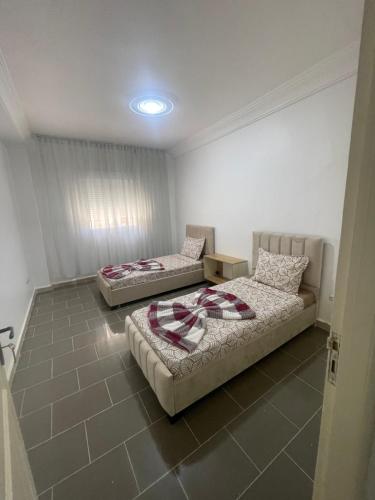 Postel nebo postele na pokoji v ubytování Spacieux Appartement a 2pas a la plage