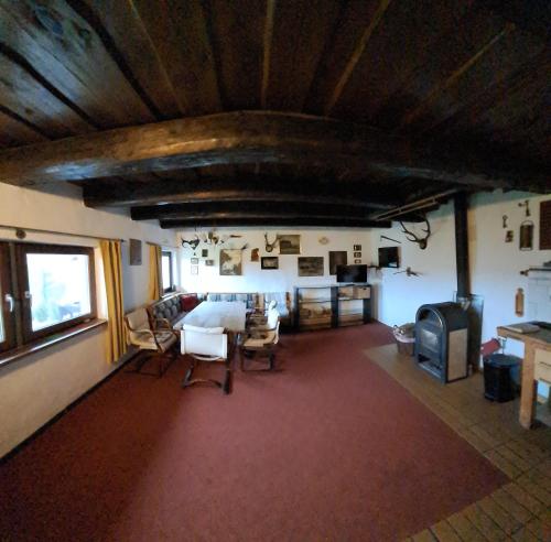a room with a large room with a table and chairs at Chalupa na Maňavě in Maňava