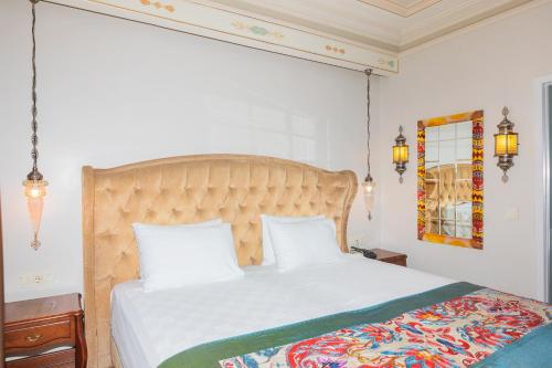 Katil atau katil-katil dalam bilik di Azade Premier Hotel
