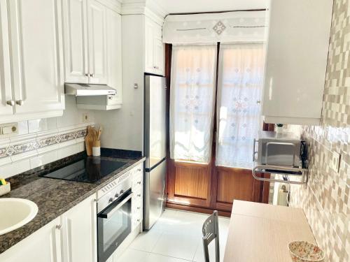 Кухня или мини-кухня в Cimadevilla 16
