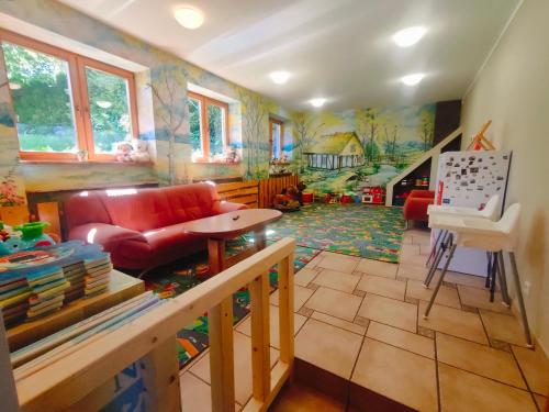 a living room with a couch and a table at Willa Jasiu in Władysławowo