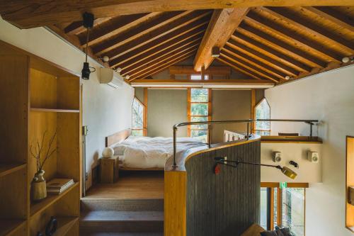 Postel nebo postele na pokoji v ubytování SANU 2nd Home KOSO 安曇野