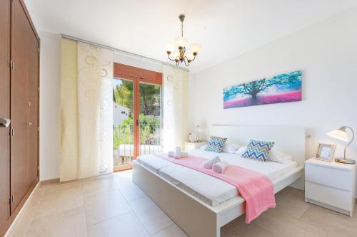 Giường trong phòng chung tại Villa Lia - PlusHolidays