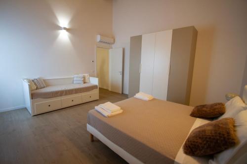 a living room with two beds and a couch at Altichiero 105 in Padova