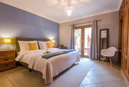 Villa Conmigo Bed & Breakfast tesisinde bir odada yatak veya yataklar