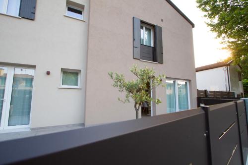 a house with a black fence in front of it at Altichiero 105 in Padova