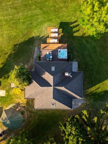 an overhead view of a building in a field at Hilltop House. in Erdut