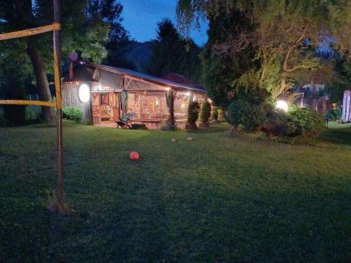 a house with a ball in the yard at night at O.W. Blue Cafe in Krościenko