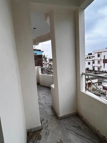 an empty apartment balcony with a view of a city at Bihar stay properties 2 bhk in Patna