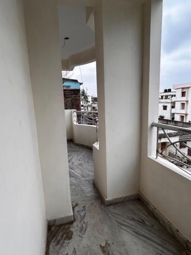an empty room with a view of a building at Bihar stay properties 2 bhk in Patna