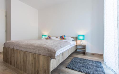 Ένα ή περισσότερα κρεβάτια σε δωμάτιο στο Apartments Viktorija