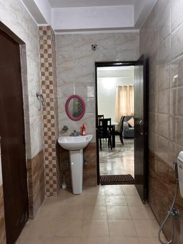 a bathroom with a sink and a mirror at Bihar stay properties 2 bhk in Patna