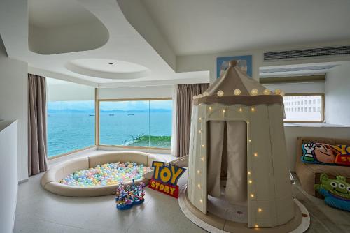 a childs room with a toy pool and a roller coaster at Shenzhen GuanHu Secret Wild Reef Seaview Hotel in Shenzhen