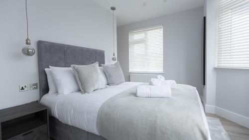 Giường trong phòng chung tại Bell House Oxford - The Punt